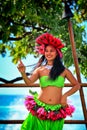 Beautiful young Polynesian Hawaiian woman performing traditional Hula dance