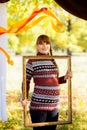 Beautiful young pregnant woman in autumn Park. Royalty Free Stock Photo