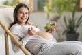 Beautiful Young Pregnant Woman Eating Fresh Vegetable Salad At Home Royalty Free Stock Photo