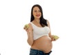 Beautiful young pregnant woman holding apples and smiling Royalty Free Stock Photo