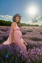 Pregnant woman in a lavender field Royalty Free Stock Photo