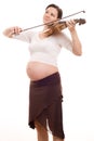 Beautiful young pregnant woman with a violin Royalty Free Stock Photo