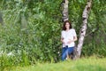 Beautiful young pregnant woman walking next to river Royalty Free Stock Photo