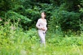 Beautiful young pregnant woman walking in a park Royalty Free Stock Photo