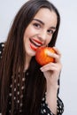 Beautiful young pretty woman, model, girl with red lips. Girl eating an apple, smiling. Closeup Royalty Free Stock Photo