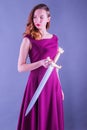 Beautiful young pure princess girl with a sword Royalty Free Stock Photo