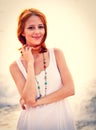 Beautiful young red-haired on the beach Royalty Free Stock Photo