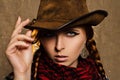 Beautiful cowgirl. Beautiful young red-haired girl in a cowboy hat Royalty Free Stock Photo