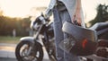 Beautiful young red-haired woman motorcyclist with black motorcycle helmet