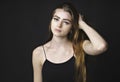 Beautiful young redhead girl with attitude a portrait on black background Royalty Free Stock Photo