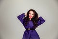 Beautiful young Russian model girl in retro clothes, she is dressed in a large male purple jacket Royalty Free Stock Photo