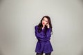 Beautiful young Russian model girl in retro clothes, she is dressed in a large male purple jacket Royalty Free Stock Photo