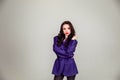 Beautiful young Russian model girl in retro clothes, she is dressed in a large male purple jacket Royalty Free Stock Photo