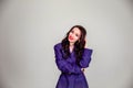 Beautiful young Russian model girl in retro clothes, she is dressed in a large male purple jacket Royalty Free Stock Photo