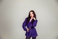 Beautiful young Russian model girl in retro clothes, she is dressed in a large male purple jacket Royalty Free Stock Photo