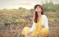 Beautiful young sad woman portrait against sunset autumn field Royalty Free Stock Photo