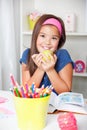 Beautiful young school girl eating an apple Royalty Free Stock Photo