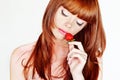 Beautiful young red hair woman with strawberries