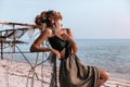 Beautiful young sensual boho style woman posing outdoors at sunset Royalty Free Stock Photo