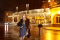 Beautiful young blonde wearing evening makeup in elegant fitting dress fashionable stylish expensive fur coat walk night stre