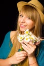 The beautiful young girl with flowers in the hand Royalty Free Stock Photo