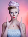 Beautiful young pin-up girl with surprised expression Royalty Free Stock Photo