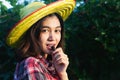 Beautiful young smart farmers showing and eating mulberry fruits Royalty Free Stock Photo