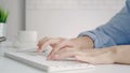 Beautiful young smiling Asian woman working on laptop while at home in office work space. Businesswoman working from home via Royalty Free Stock Photo