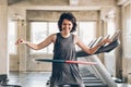 Young smiling happy Caucasian sporty woman playing hula hoop inside gym studio Royalty Free Stock Photo