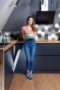 Beautiful young woman doing dishes in the kitchen Royalty Free Stock Photo