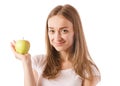 Beautiful young smiling woman holding an apple in her hands Royalty Free Stock Photo