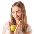 Beautiful young smiling woman holding an apple in her hands Royalty Free Stock Photo