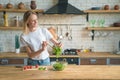 Beautiful young smiling woman making salad in the kitchen. Healthy food. vegetable salad. Diet. Healthy lifestyle. cooking at home Royalty Free Stock Photo