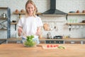 Beautiful young smiling woman making salad in the kitchen. Healthy food. vegetable salad. Diet. Healthy lifestyle. cooking at home Royalty Free Stock Photo