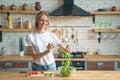 Beautiful young smiling woman making salad in the kitchen. Healthy food. vegetable salad. Diet. Healthy lifestyle. cooking at home Royalty Free Stock Photo