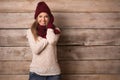 Beautiful young smiling woman over wooden background Royalty Free Stock Photo