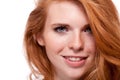 Beautiful young smiling woman with red hair and freckles isolated Royalty Free Stock Photo