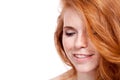 Beautiful young smiling woman with red hair and freckles isolated Royalty Free Stock Photo