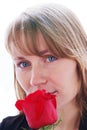 Beautiful young smiling woman with red rose Royalty Free Stock Photo