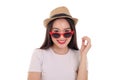 Beautiful young south east Asian woman wearing red frame sunglass eyewear hat pose fashion style white background look around copy