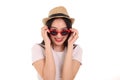 Beautiful young south east Asian woman wearing red frame sunglass eyewear hat pose fashion style white background look around copy