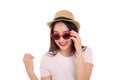 Beautiful young south east Asian woman wearing red frame sunglass eyewear hat pose fashion style white background look around copy