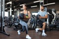 Beautiful young sports couple is working out with medicine ball in gym Royalty Free Stock Photo