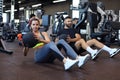 Beautiful young sports couple is working out with medicine ball in gym Royalty Free Stock Photo