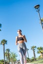 Beautiful young sports Woman running jogging in a park outdoors listening music Royalty Free Stock Photo