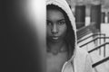 Beautiful young sportswoman in hood looking at camera Royalty Free Stock Photo