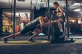 Beautiful young sporty couple training, workout in gym together Royalty Free Stock Photo