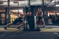 Beautiful young sporty couple training, workout in gym together Royalty Free Stock Photo