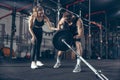 Beautiful young sporty couple training, workout in gym together Royalty Free Stock Photo