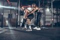 Beautiful young sporty couple training, workout in gym together Royalty Free Stock Photo